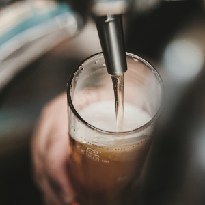 beer glass getting filled with beer